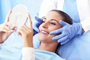 Patient viewing her smile during cosmetic treatment